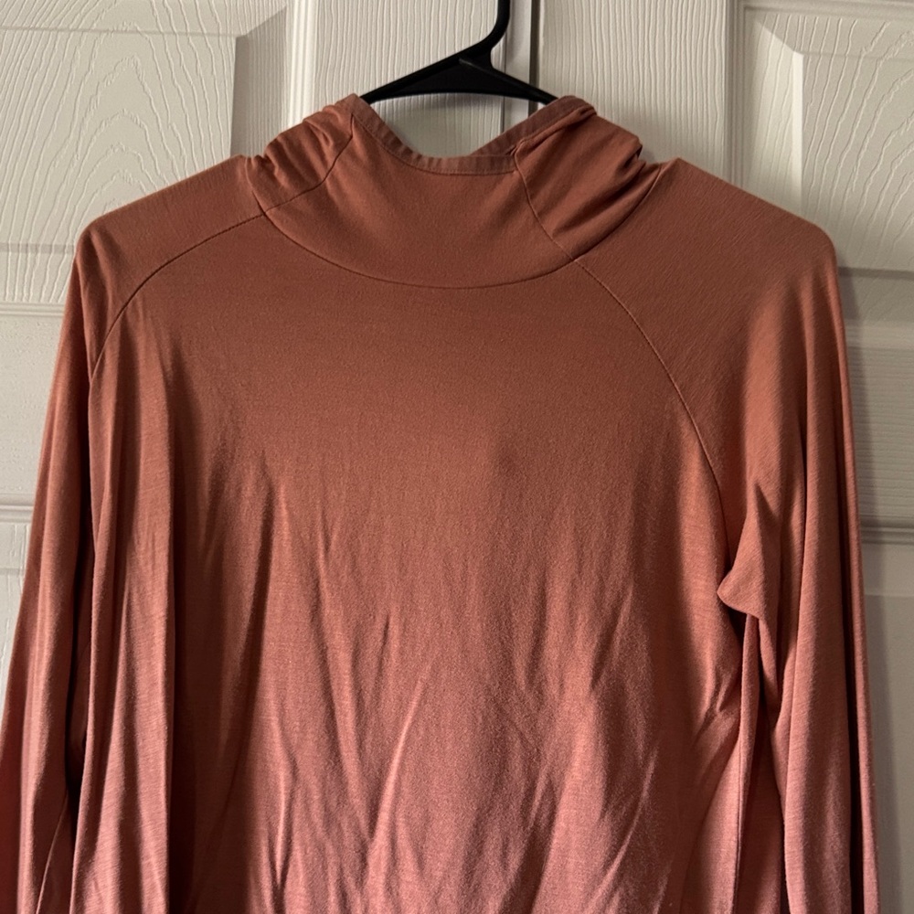 Free fly mock neck hooded shirt in a dusty rose color.